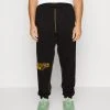 Puma In The Paint - Tracksuit Bottoms - Black -Fashion clothing 05e643d9344545c1a9d5e2ac0932bce8