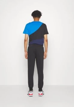 Puma Logo Pants - Tracksuit Bottoms - Black/White -Fashion clothing 141f5ec8b8784252af943856910750a6