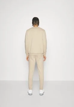 Puma Evostripe Pants Dk - Tracksuit Bottoms - Granola -Fashion clothing 58d617676af14e6299b1ea934c5c8385