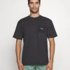 Puma Studio Unwind Tee - Sports T-Shirt - Black -Fashion clothing 8313db22b3034681aee319077d695896
