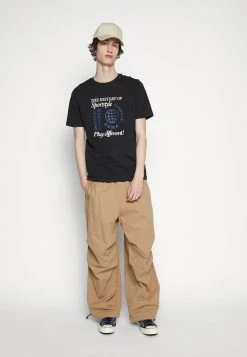 Puma Graphics Legacy Archive Tee - Print T-Shirt - Black -Fashion clothing b20eeef91e774d9f93ab736dcd9a089e