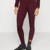 Puma Ess+ Metallic - Leggings - Aubergine -Fashion clothing bd81a5bbc19b4c2abce6d5d2cfc8f48f
