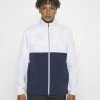 PUMA Golf Monterey Jacket - Windbreaker - White Glow/Navy Blazer -Fashion clothing e45be427f6ac48d6acd343bfd294a8c3